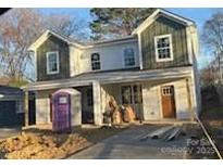 New construction two-story home with mixed siding and a front yard under construction at 1518 Norris Ave, Charlotte, NC 28206