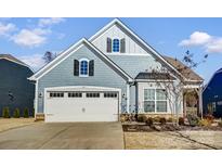 Charming home with a two-car garage and well-manicured landscaping at 427 Kentmere Ln, Lake Wylie, SC 29710