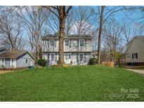 Charming two-story home with manicured lawn and inviting curb appeal at 9613 Central Dr, Mint Hill, NC 28227