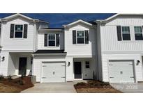 Charming two-story home with white siding, black shutters, and an attached one-car garage at 2090 Old Rivers Rd, Concord, NC 28027