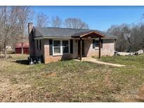 Charming one-story brick home featuring a covered porch and a well-maintained front yard at 1640 Old Friendship Rd, Rock Hill, SC 29730