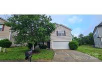 Charming two-story home with a well-maintained front yard and attached garage at 2108 Cranberry Woods Ct, Charlotte, NC 28208