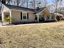 Charming single story home with welcoming front porch and manicured landscaping at 1937 Hickory Dr, Lancaster, SC 29720