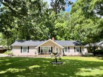 Charming ranch home with a well-manicured lawn and a welcoming front porch, perfect for enjoying the outdoors at 1937 Hickory Dr, Lancaster, SC 29720