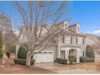 Charming two-story home featuring a two-car garage, inviting entrance and well-manicured landscaping at 944 Treasure Ct, Fort Mill, SC 29708