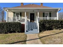 Charming single-Gathering home showcasing a cozy front porch and well-maintained landscaping at 516 W 7Th St, Kannapolis, NC 28081