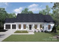 Charming single-story home with a welcoming front porch and a spacious two-car garage at 113 Camille Dr, Shelby, NC 28150