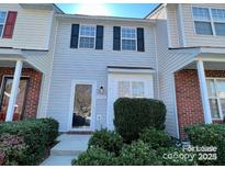 Charming townhouse showcasing a well-maintained front yard, and bright exterior at 1754 Pergola Pl, Charlotte, NC 28213