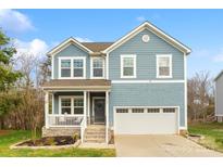 Charming two-story home showcasing blue siding, stone accents, and a welcoming front porch at 18607 Mainsail Ct, Lancaster, SC 29720