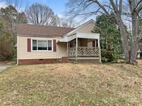 Charming single-story home with a covered front porch and vinyl siding at 220 Valleyview Pl, Salisbury, NC 28144