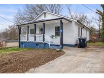 Charming renovated home features a welcoming front porch, and a freshly landscaped yard at 98 Ring Sw Ave, Concord, NC 28025