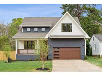 Charming two-story home with a modern farmhouse design and well-maintained landscaping at 1210 Skyview Rd, Charlotte, NC 28208