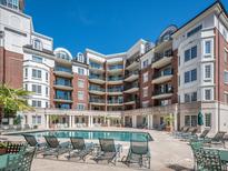 Resort-style apartments overlooking a pool and lounge area, offering luxury and leisure at 300 W 5Th W St # 407, Charlotte, NC 28202