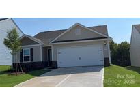 Charming single-story home with a two-car garage and well-maintained lawn at 1550 Doran Ter, Richburg, SC 29729