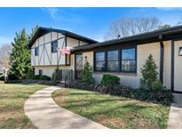 Inviting home with a well-manicured lawn, a charming front entrance, and an American flag at 2530 31St Street Ne Dr, Hickory, NC 28601