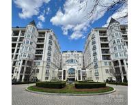 Elegant condominium with manicured grounds, featuring manicured hedges and striking architecture at 2823 Providence Rd # 236, Charlotte, NC 28211