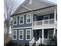 Charming two-story home featuring a welcoming front porch and classic architectural details at 615 R L Stowe Rd, Belmont, NC 28012