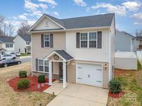 Charming two-story home with a well-maintained yard and attached garage in a desirable neighborhood at 1301 Waylon Ave, Gastonia, NC 28054