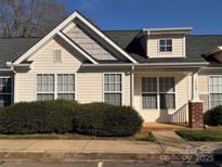 Charming home exterior with a well-manicured yard and classic architectural details at 1509 Tiana Way, Rock Hill, SC 29732