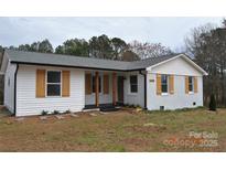 Charming single-story home with white siding, black trim, and wooden shutters at 2400 Pressley Rd, Chester, SC 29712