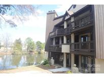 Charming townhouse with multiple balconies overlooks a tranquil lake at 8149 Cedar Glen Dr # 8149, Charlotte, NC 28212