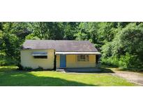 Charming one-story home featuring a quaint porch and a blue front door at 819 Circle Vw, Gastonia, NC 28054