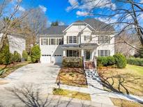 Charming two-story home featuring a two-car garage, landscaped front yard, and inviting front porch at 9433 Gilpatrick Ln, Huntersville, NC 28078