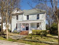 Charming two-story home with a welcoming front porch and landscaped front yard at 225 Marion St, Rock Hill, SC 29730