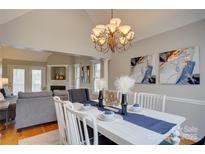 Elegant dining room with a modern chandelier, stylish decor, and an open layout at 5306 Club View Dr, Concord, NC 28025