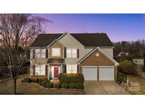 Charming two-story home with a well-manicured lawn, two-car garage, and inviting front entrance at 252 Legend Dr, Rock Hill, SC 29732