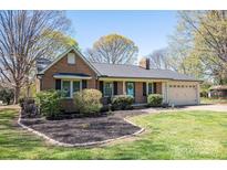 Charming single-story brick home with a manicured lawn and mature trees at 119 Tara Ter, Kings Mountain, NC 28086