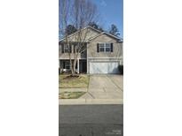 Charming two-story home with a well-maintained lawn and a two car garage at 10114 Turkey Point Dr, Charlotte, NC 28214