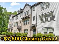 Modern townhome with brick and siding, showcasing stylish architecture and well-maintained landscaping at 12312 Landry Renee Pl # 35, Charlotte, NC 28277