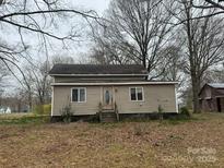 Charming single-story home with neutral siding, complemented by well-maintained landscaping and inviting entrance at 3708 Secrest Shortcut Rd, Monroe, NC 28110
