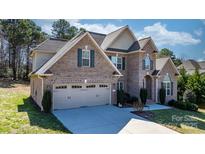 Lovely brick home with a large garage and well-maintained landscaping at 3815 10Th Ne St, Hickory, NC 28601
