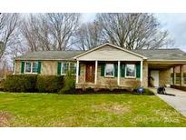 Charming single-story brick home with well-maintained landscaping and a cozy front porch at 108 Colonial Dr, Kings Mountain, NC 28086