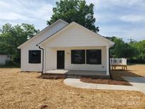 Charming home with white siding, new landscaping, and a covered front porch at 2200 Clay St # 2, Kannapolis, NC 28083