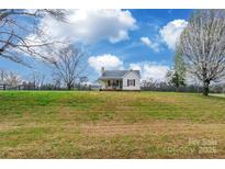Charming exterior view of a quaint single story home on a sprawling green lot under a bright blue sky at 2455 Wellridge Rd, Chester, SC 29706