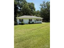 Charming one-story home featuring a well-manicured lawn and inviting curb appeal at 5949 Flat Creek Rd, Kershaw, SC 29067
