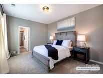 Comfortable bedroom with gray carpet and neutral colored walls providing a relaxing retreat at 8117 Jacey Ln # 42, Huntersville, NC 28078