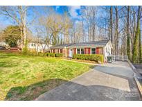 Charming single-story brick home with a well-manicured lawn and inviting curb appeal at 1203 Northwoods Dr, Kings Mountain, NC 28086