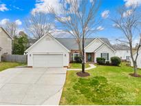 Charming single-story home with a two-car garage, well-manicured lawn, and inviting curb appeal at 134 Citation Dr, Mooresville, NC 28117