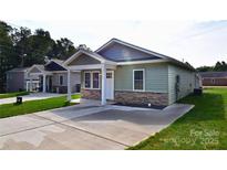 Charming single-story home with stone accents and a well-manicured lawn at 1479 Southwest Blvd, Newton, NC 28658