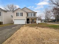 Charming two-story home with vinyl siding and a well-manicured lawn at 2006 Durand Rd, Fort Mill, SC 29715