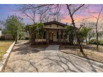 Charming bungalow with a welcoming front porch and well-maintained landscaping at 211 W 6Th Ave, Gastonia, NC 28052