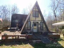 Charming A-frame home with a large deck perfect for outdoor relaxation and enjoying the natural surroundings at 13062 Highway 55 W Hwy, York, SC 29745