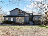 Charming two-story home featuring a stone facade and professionally landscaped front yard at 13424 Portside Ct, Charlotte, NC 28278