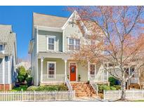 Charming two-story home with a welcoming front porch and a bright orange front door at 122 Blandina Ct, Fort Mill, SC 29708