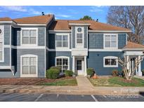 Inviting exterior of home featuring blue siding, brown roof, and manicured landscaping at 17527 Tuscany Ln, Cornelius, NC 28031