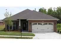 A charming single-story brick house featuring an attached two-car garage and manicured front lawn at 2608 Glyncastle Way, Gastonia, NC 28056